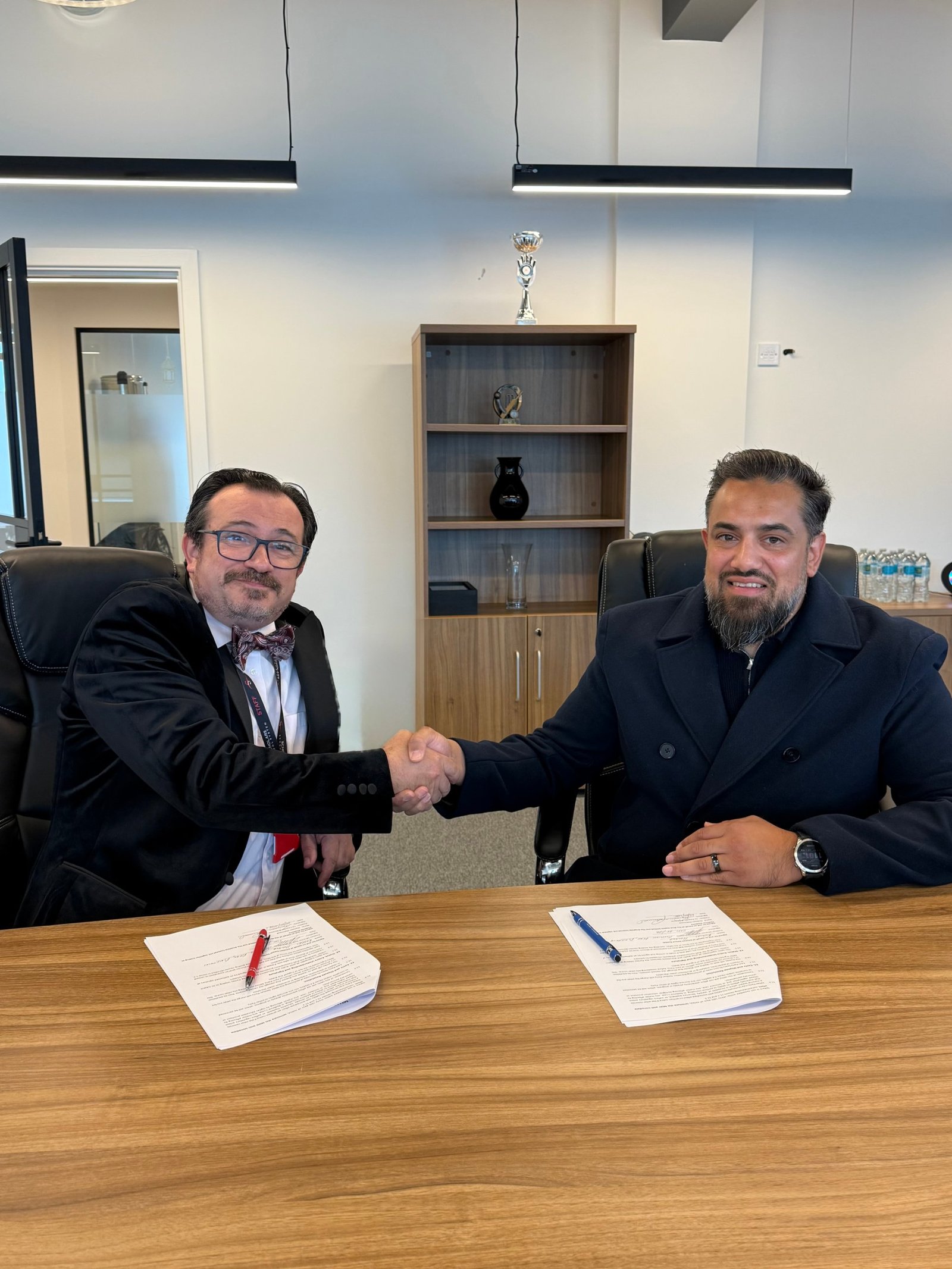 Redbrick Academy and Scholars School System shake hands over the signed partnership agreement